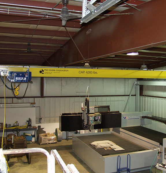 2 Ton TRSG crane servicing a water jet cutter