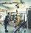 Vacuum lifter with electric powered tilt