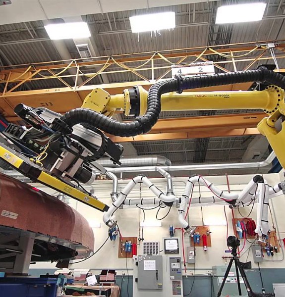 Tilt table used manipulate heat shield for robotic xray inspection
